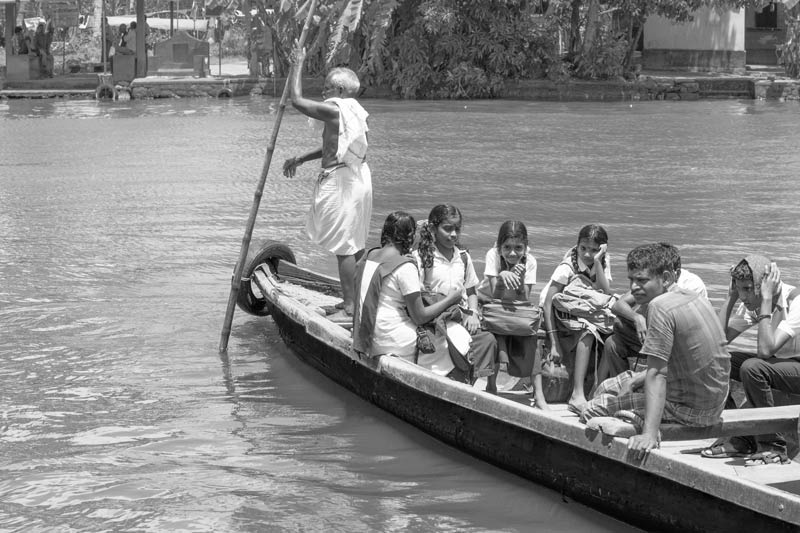 Living Below the Sea Level - Children travelling to school in the morning on a local boat in Alappuzha district, Kerala